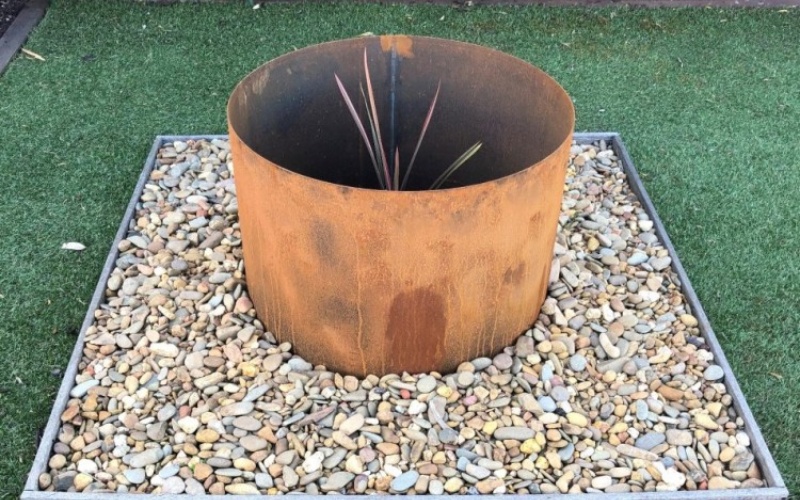 rusty metal garden planter for modern landscaping
